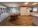 Bright kitchen with white cabinets, wood-look floors, and stainless steel appliances at 1785 Quail Hill Dr, Lakeland, FL 33810