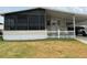 Mobile home with carport and screened porch at 1785 Quail Hill Dr, Lakeland, FL 33810
