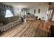 Spacious living room with wood-look floors and neutral decor at 1785 Quail Hill Dr, Lakeland, FL 33810