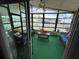 Bright sunroom with windows offering scenic views at 1785 Quail Hill Dr, Lakeland, FL 33810