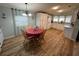 Kitchen dining area with wood-look floors and a table for four at 1785 Quail Hill Dr, Lakeland, FL 33810