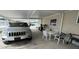 Covered carport with patio furniture and a Jeep at 1785 Quail Hill Dr, Lakeland, FL 33810