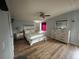 Spacious main bedroom with wood-look floors and large dresser at 1785 Quail Hill Dr, Lakeland, FL 33810
