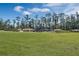 Community playground with wooden playset and slides at 13032 Sunrise Harvest Dr, Winter Garden, FL 34787