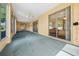 Spacious Florida room with carpet flooring and access to backyard at 2172 Nw 50Th Cir, Ocala, FL 34482