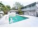 Large rectangular pool with a spa and home view at 2955 Lolissa Ln, Winter Park, FL 32789