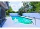 Inviting kidney-shaped pool with a large patio area at 2955 Lolissa Ln, Winter Park, FL 32789