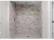 Large walk-in shower with marble-style tile at 4790 Anderson Rd, Orlando, FL 32812