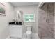 Modern bathroom with a walk-in shower and vanity at 4790 Anderson Rd, Orlando, FL 32812