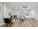 Studio apartment with a bed, sofa and dining area at 4790 Anderson Rd, Orlando, FL 32812