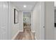 Clean hallway with wood-look floors leading to living area at 4790 Anderson Rd, Orlando, FL 32812