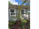 Newly planted tree with pink flowers near house at 4790 Anderson Rd, Orlando, FL 32812