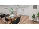 Small dining area with glass-top table and black chairs at 4790 Anderson Rd, Orlando, FL 32812