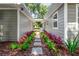 Stone walkway with lush landscaping between house sections at 4790 Anderson Rd, Orlando, FL 32812