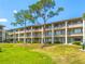 Two-story apartment building with balconies and green lawn at 115 Oyster Bay Cir # 340, Altamonte Springs, FL 32701