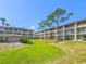 Two-story apartment building with balconies and green lawn at 115 Oyster Bay Cir # 340, Altamonte Springs, FL 32701