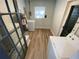 Laundry room with washer, dryer, and wood-look flooring at 2308 Lake Helen Osteen Rd, Deltona, FL 32738