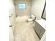 Updated bathroom with a bathtub, toilet and vanity at 2308 Lake Helen Osteen Rd, Deltona, FL 32738