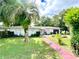 Charming ranch-style home with well-manicured lawn at 2308 Lake Helen Osteen Rd, Deltona, FL 32738