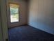 Bright bedroom with carpet flooring and a window at 45814 Lake St, Paisley, FL 32767