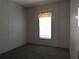 Bright bedroom with carpeted flooring and a window with blinds at 45814 Lake St, Paisley, FL 32767