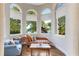 Cozy sitting area with a chaise lounge and lake views at 1911 Lake Markham Preserve Trl, Sanford, FL 32771