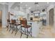 Modern kitchen with large island, granite countertops, and stainless steel appliances at 1911 Lake Markham Preserve Trl, Sanford, FL 32771