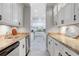 Butlers pantry with granite counters and stainless steel appliances at 1911 Lake Markham Preserve Trl, Sanford, FL 32771