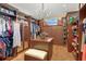 Large Primary closet with custom shelving and island at 1911 Lake Markham Preserve Trl, Sanford, FL 32771