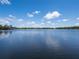 Serene lakefront view with clear blue skies at 1911 Lake Markham Preserve Trl, Sanford, FL 32771