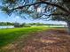 Peaceful waterfront property with lush lawn and shade trees at 1911 Lake Markham Preserve Trl, Sanford, FL 32771
