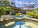 Relaxing spa and pool area with tropical landscaping at 1911 Lake Markham Preserve Trl, Sanford, FL 32771
