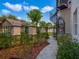 Stone pathway with landscaping leading to a waterfront gate at 1911 Lake Markham Preserve Trl, Sanford, FL 32771