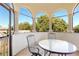 Covered balcony with arched windows and outdoor seating at 1911 Lake Markham Preserve Trl, Sanford, FL 32771