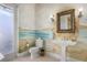 Elegant bathroom with seascape mural, pedestal sink, and frameless glass shower at 1911 Lake Markham Preserve Trl, Sanford, FL 32771