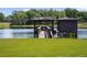 Private boat dock with covered seating area and a lake view at 1911 Lake Markham Preserve Trl, Sanford, FL 32771
