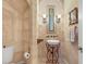 Stylish powder room with a pedestal sink and mosaic tile at 1911 Lake Markham Preserve Trl, Sanford, FL 32771