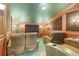 Home theater with brown leather recliners and wood paneled walls at 1911 Lake Markham Preserve Trl, Sanford, FL 32771