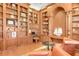 Spacious library with built-in bookshelves and comfortable seating at 1911 Lake Markham Preserve Trl, Sanford, FL 32771