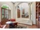 Elegant library with built-in bookshelves, arched entryway and comfortable seating at 1911 Lake Markham Preserve Trl, Sanford, FL 32771