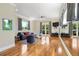 Spacious game room with hardwood floors, large windows, and mirrored wall at 1911 Lake Markham Preserve Trl, Sanford, FL 32771