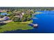Luxury lakefront home with lush landscaping and private dock at 1911 Lake Markham Preserve Trl, Sanford, FL 32771