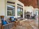 Stone patio with fireplace and comfortable seating at 1911 Lake Markham Preserve Trl, Sanford, FL 32771