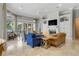 Spacious living room with fireplace and built-in shelving, featuring ample natural light and comfortable seating at 1911 Lake Markham Preserve Trl, Sanford, FL 32771