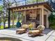Outdoor kitchen and seating area overlooking the lake at 1911 Lake Markham Preserve Trl, Sanford, FL 32771