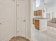 Bright hallway with neutral carpeting and access to bedrooms at 1112 Royal Marquis Cir, Ocoee, FL 34761