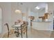 Small dining area with a round glass table and four chairs at 1112 Royal Marquis Cir, Ocoee, FL 34761