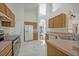 Spacious kitchen with stainless steel appliances and wood cabinets at 1112 Royal Marquis Cir, Ocoee, FL 34761