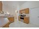 Kitchen features wood cabinets, stainless steel appliances, and tile floors at 1112 Royal Marquis Cir, Ocoee, FL 34761