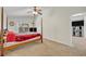 Large bedroom with a four-poster bed, access to another room, and a TV at 1112 Royal Marquis Cir, Ocoee, FL 34761